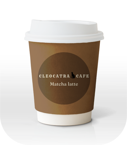 A coffee cup with a Cleocatra Cafe logo and brown colour matcha latte label on it.